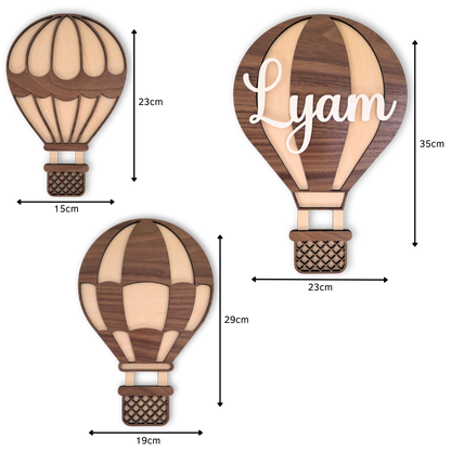 Set van 3 gepersonaliseerde houten luchtballonnen met hun afmetingen.