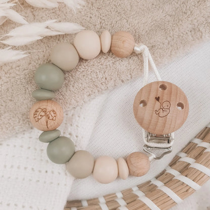 Speenkoord zonder naam met siliconen kralen in beige en groen met houten details.